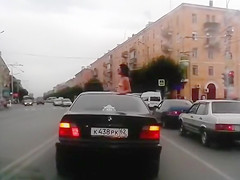 Topless chick riding in a BMW whilst in Russian Federation