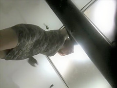 Woman tries on a skintight suit