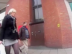 Boots and tights on a golden-haired on the street