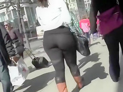 Large wazoo woman walks the town streets in spandex