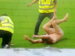 Undressed maniac runs around the football field