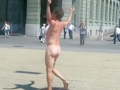 Undressed stud runs around a public square and acquires attention