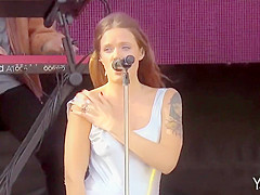 Gracious inked singer shows off one of her wobblers at a show