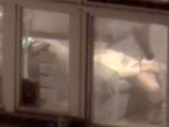 Enchanting playgirl filmed masturbating throughout apartment window