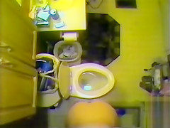 Ceiling web camera films her nude in the bath