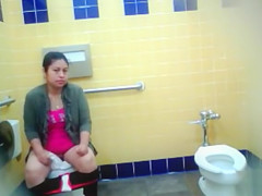 Curvy mom pisses in the public water closet