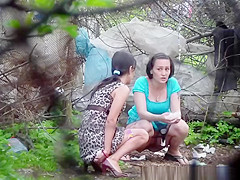 2 brunette hair chicks spied pissing outdoors