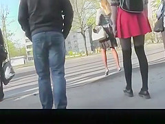 Cutie in red short petticoat and dark leggings upskirted