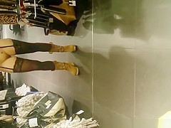 Exhibitionist woman lifts costume in store