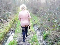 Woman bare in woodland