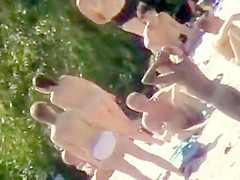 Youthful nudists take off their raiment to soak up some sun on