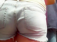 Following a cutie in short jeans panties