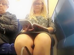 Woman reading a book in teach upskirted