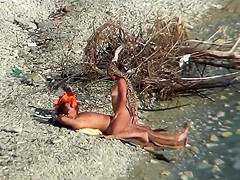 Pair fucking on a public beach, during the time that walking past people