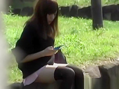 Oriental legal age teenager chick secretly filmed upskirt outdoors in public
