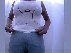 Breasty woman in beach cabin