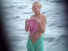 Nudist sweethearts in the sea