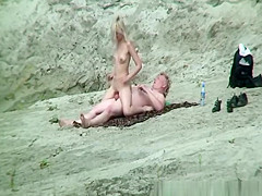 Stripped pair fucking in the rocks
