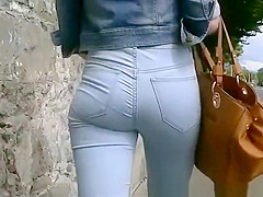 Gal in constricted jeans panties and jacket