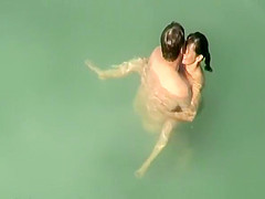Nudist sex in the water