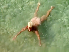 Aged nudist blond woman