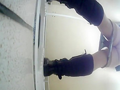 Overweight woman pissing in WC