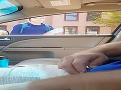 Boy plays with his knob inside car