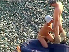 Voyeur on public beach. Fellatio sex