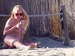 Pretty golden-haired chick flaunts her spectacular body on topless beach